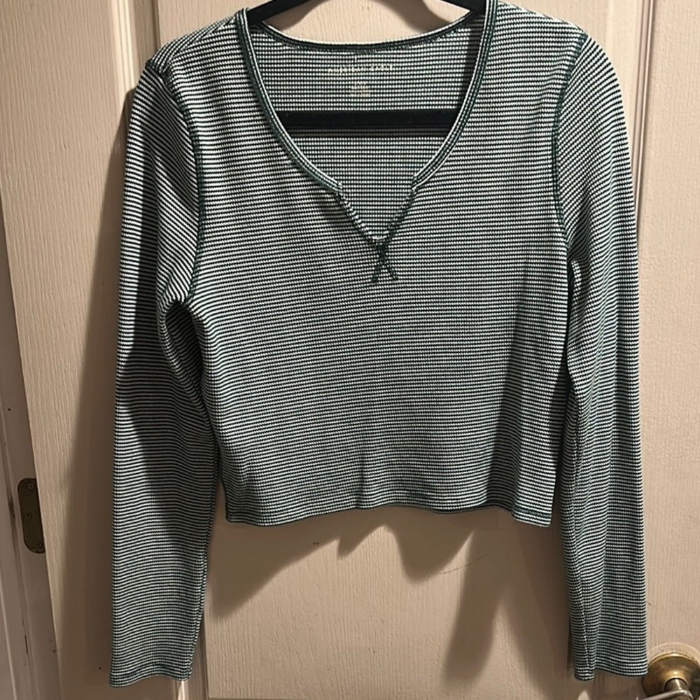Casual green and white striped long sleeve shirt.